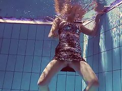 Russian Solo Model Teen Showcasing Her Shaved Pussy In Pool